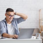 happy man with laptop