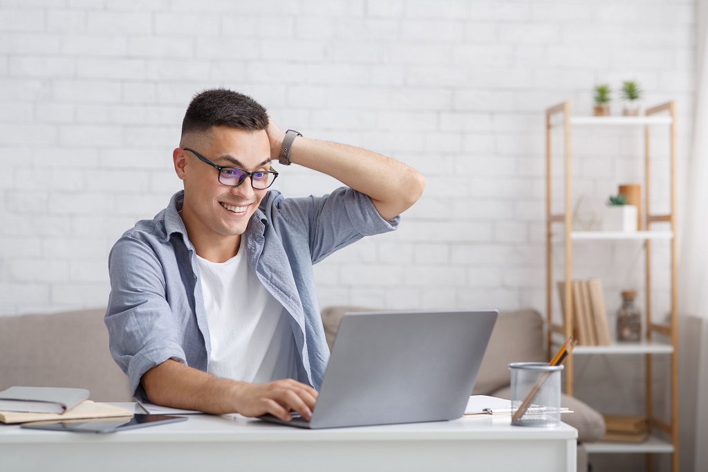 happy man with laptop